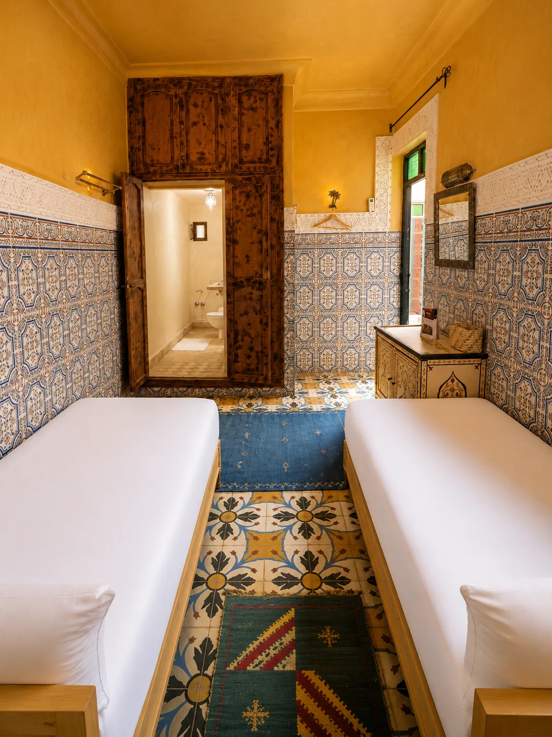 Sabah room interior detail with ochre walls and zellige mosaic